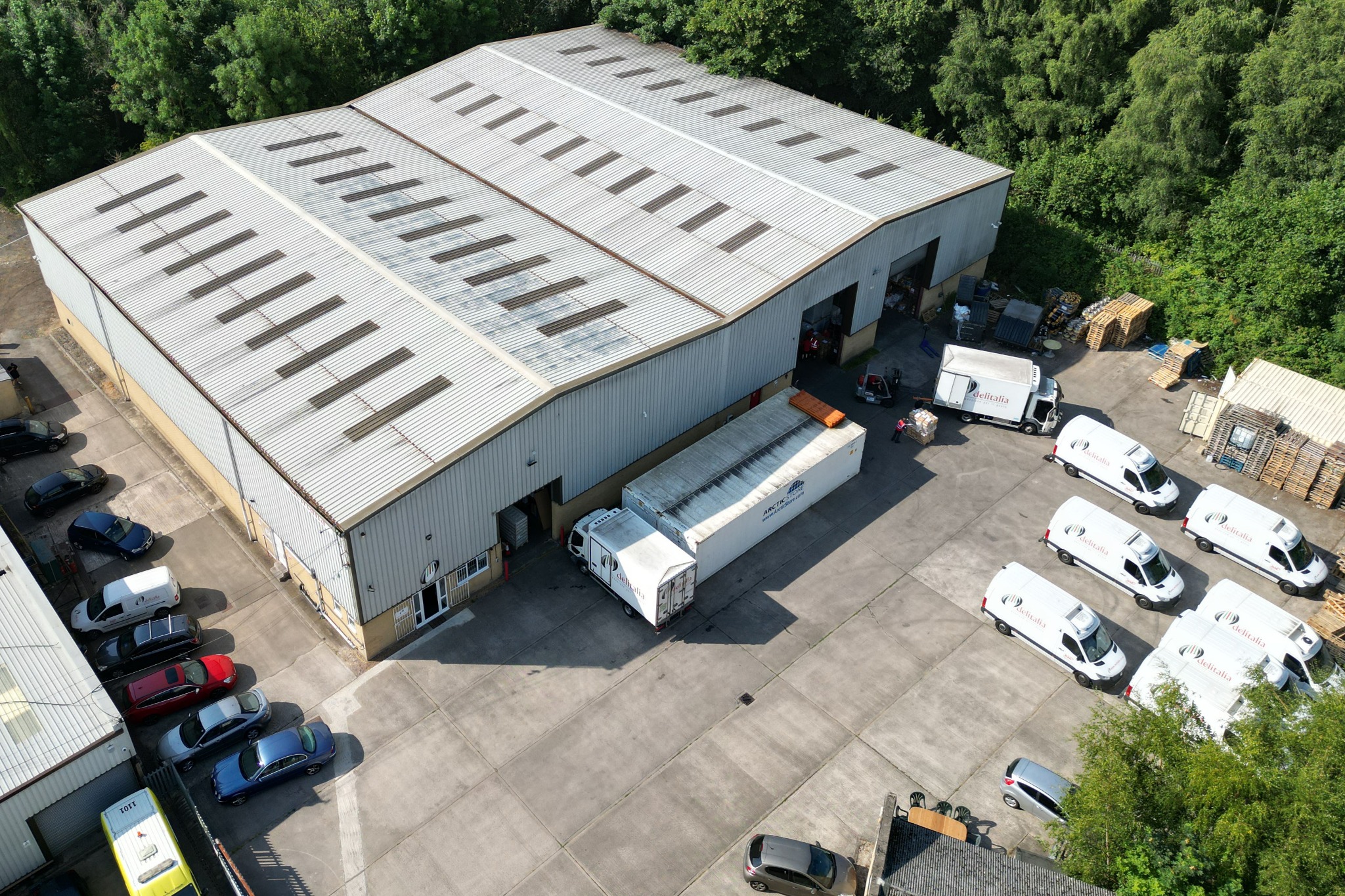Aerial view of an industrial building and its forecourt at the park