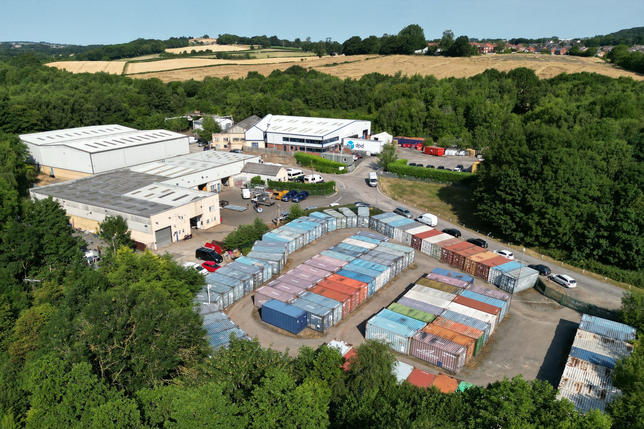 Aerial view of Strafford Industrial Park, its buildings and storage area, surrounded by Yorkshire countryside
