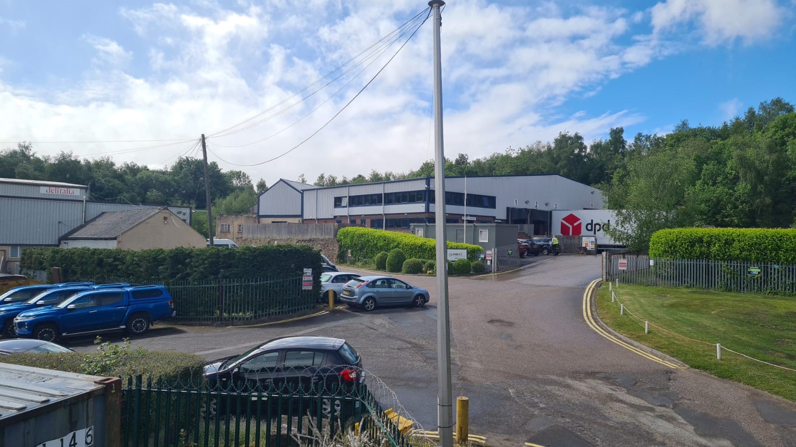 View along the approach towards the industrial buildings